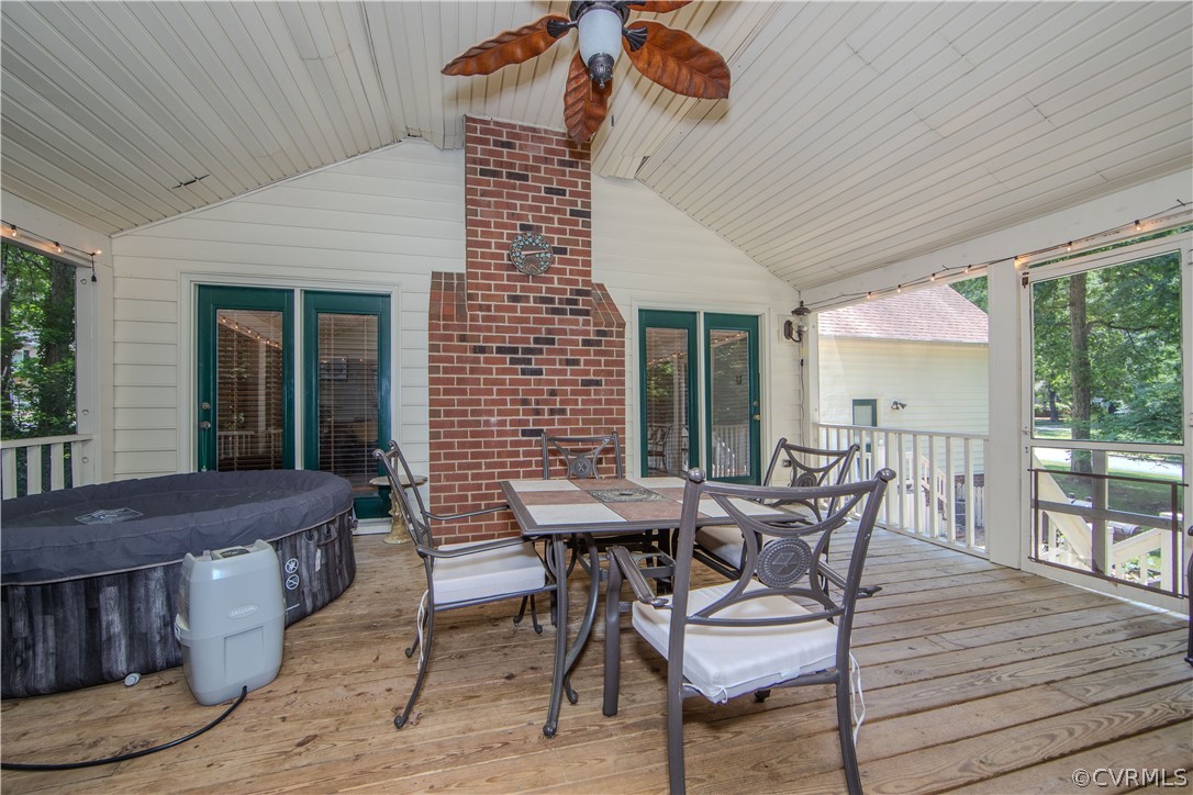2306 Shadow Ridge Court Midlothian, VA 23112 - Photo 22 of 27 a view of a roof deck with table and chairs and wooden floor