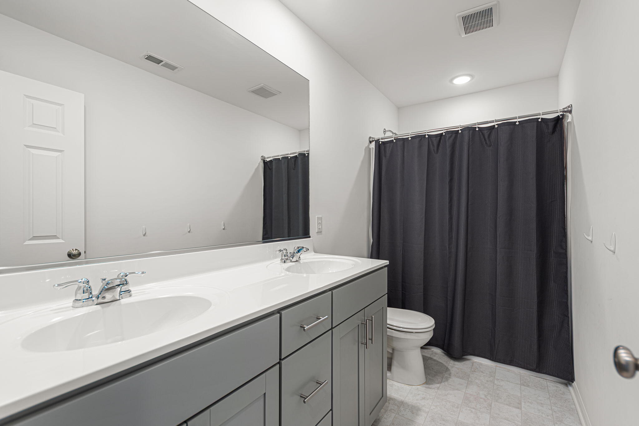 2143 West 132nd Place Crown Point, IN 46307 - Photo 23 of 35 a bathroom with a sink a toilet and mirror