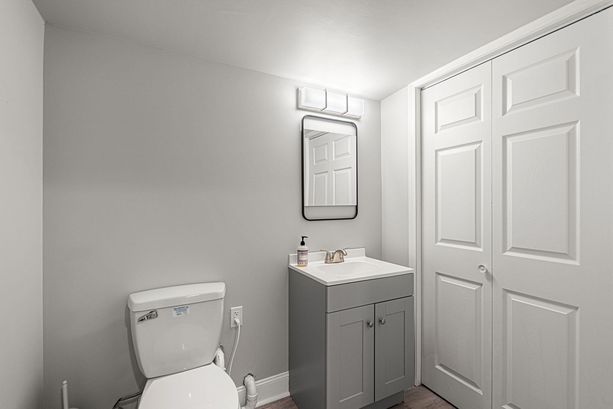 2143 West 132nd Place Crown Point, IN 46307 - Photo 29 of 35 a bathroom with a toilet sink and mirror