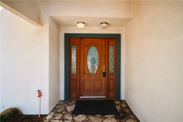 a room with wooden floor and a sink