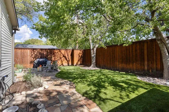 a backyard of a house with lots of green space