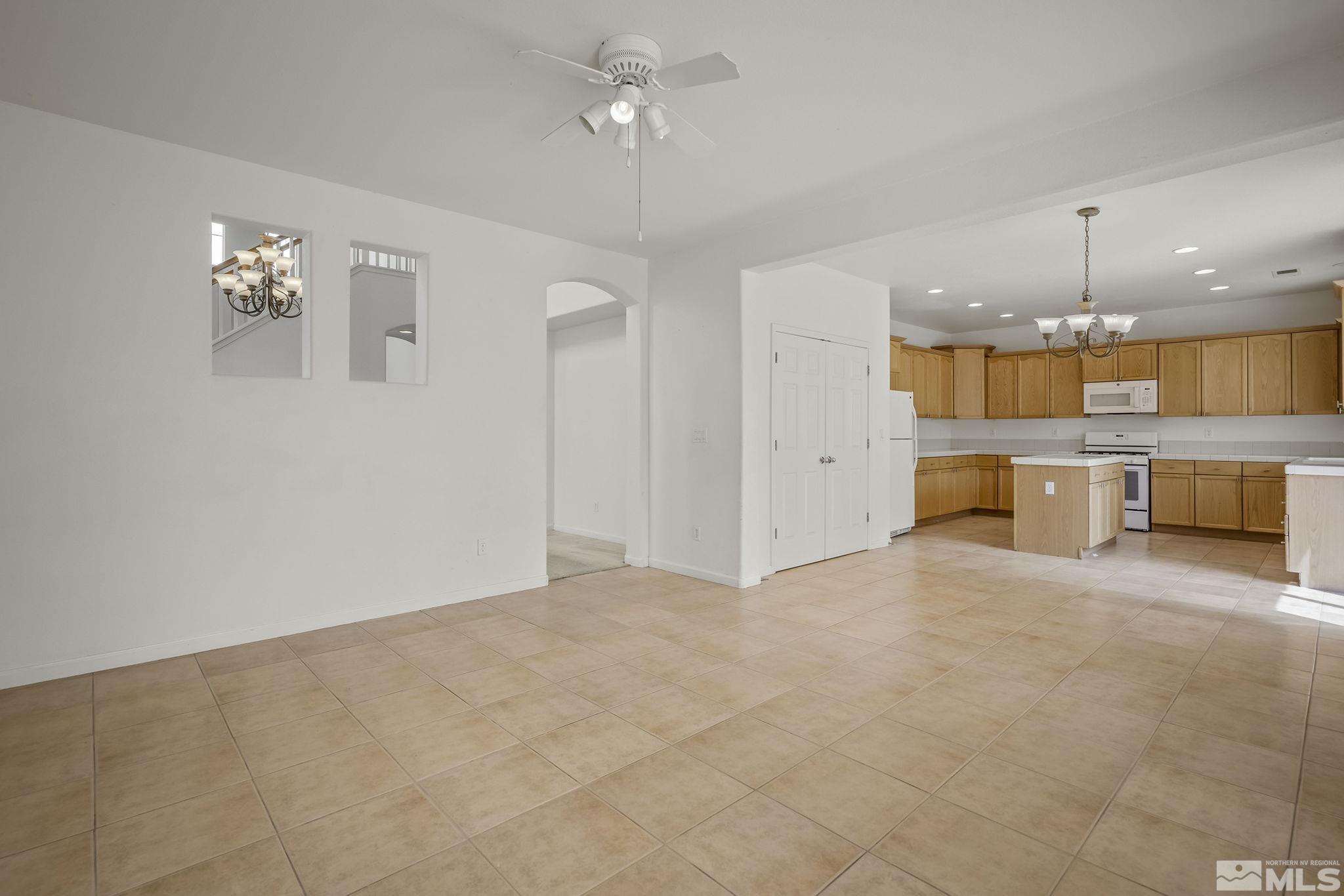 1722 Back Country Court Reno, NV 89521 - Photo 11 of 33 a view of a kitchen with a sink and chandelier kitchen view