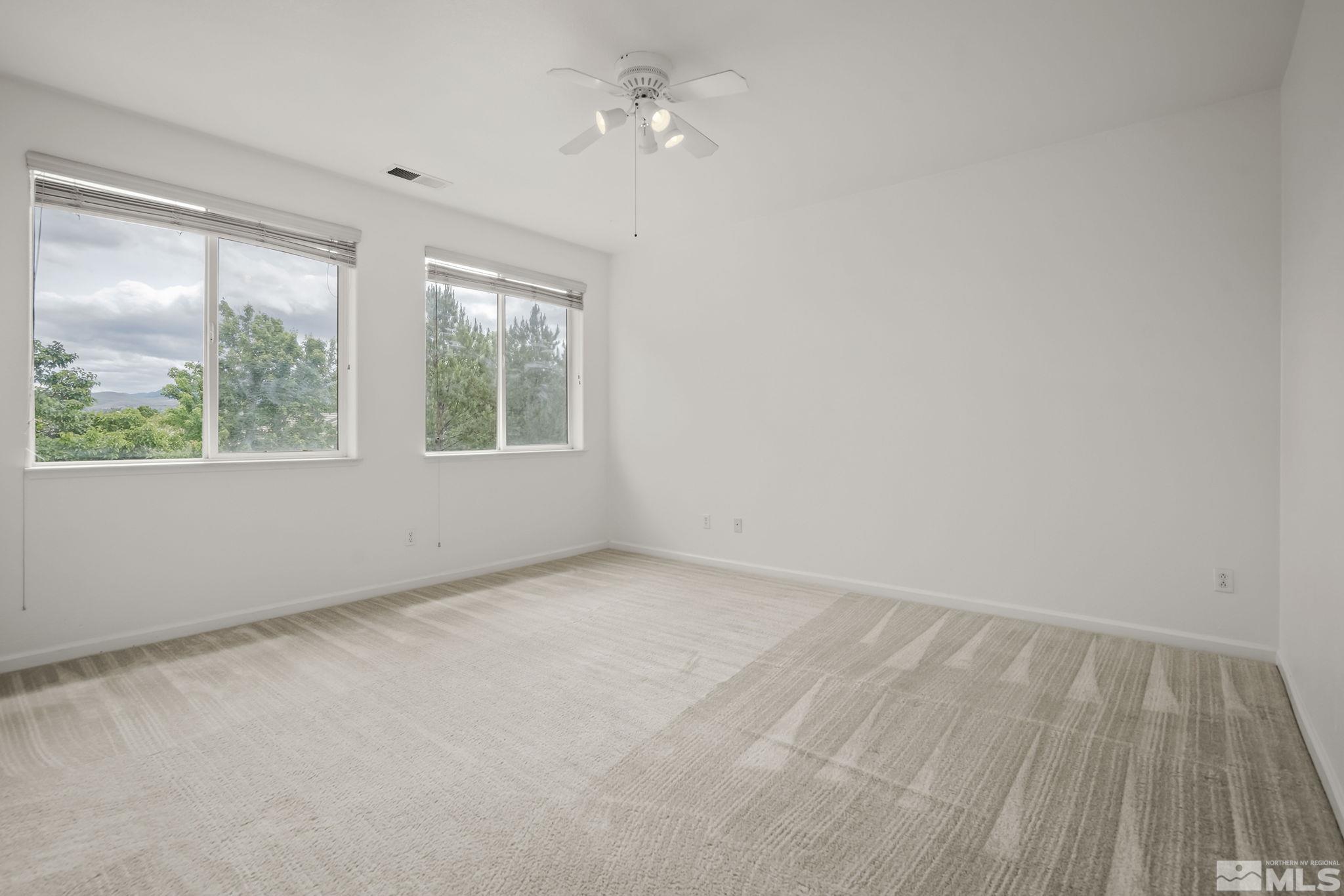 1722 Back Country Court Reno, NV 89521 - Photo 18 of 33 an empty room with a window