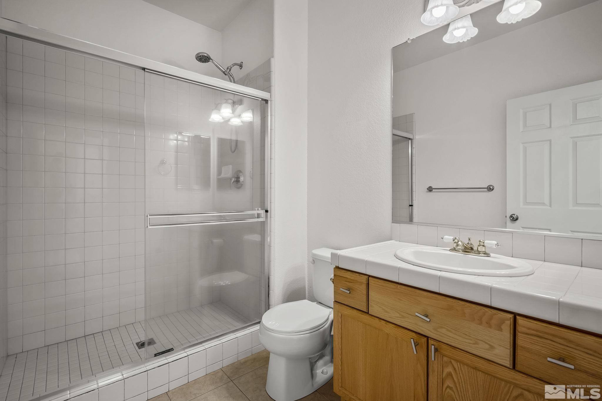 1722 Back Country Court Reno, NV 89521 - Photo 29 of 33 a bathroom with a sink toilet and shower