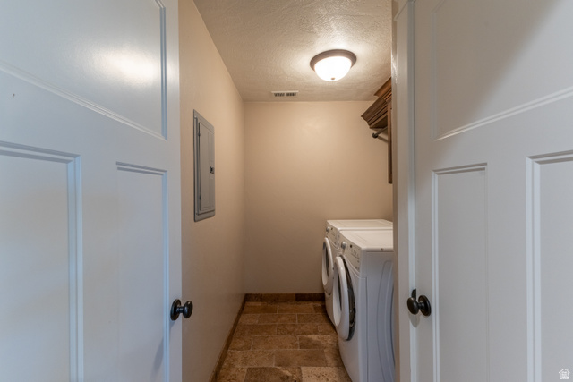 3565 West 1350th Street North Vernal, UT 84078 - Photo 35 of 54 Dedicated utility room featuring tiled flooring, a built-in wooden shelf, and an overhead flush-mount light fixture