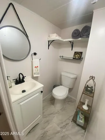 a bathroom with a sink and mirror