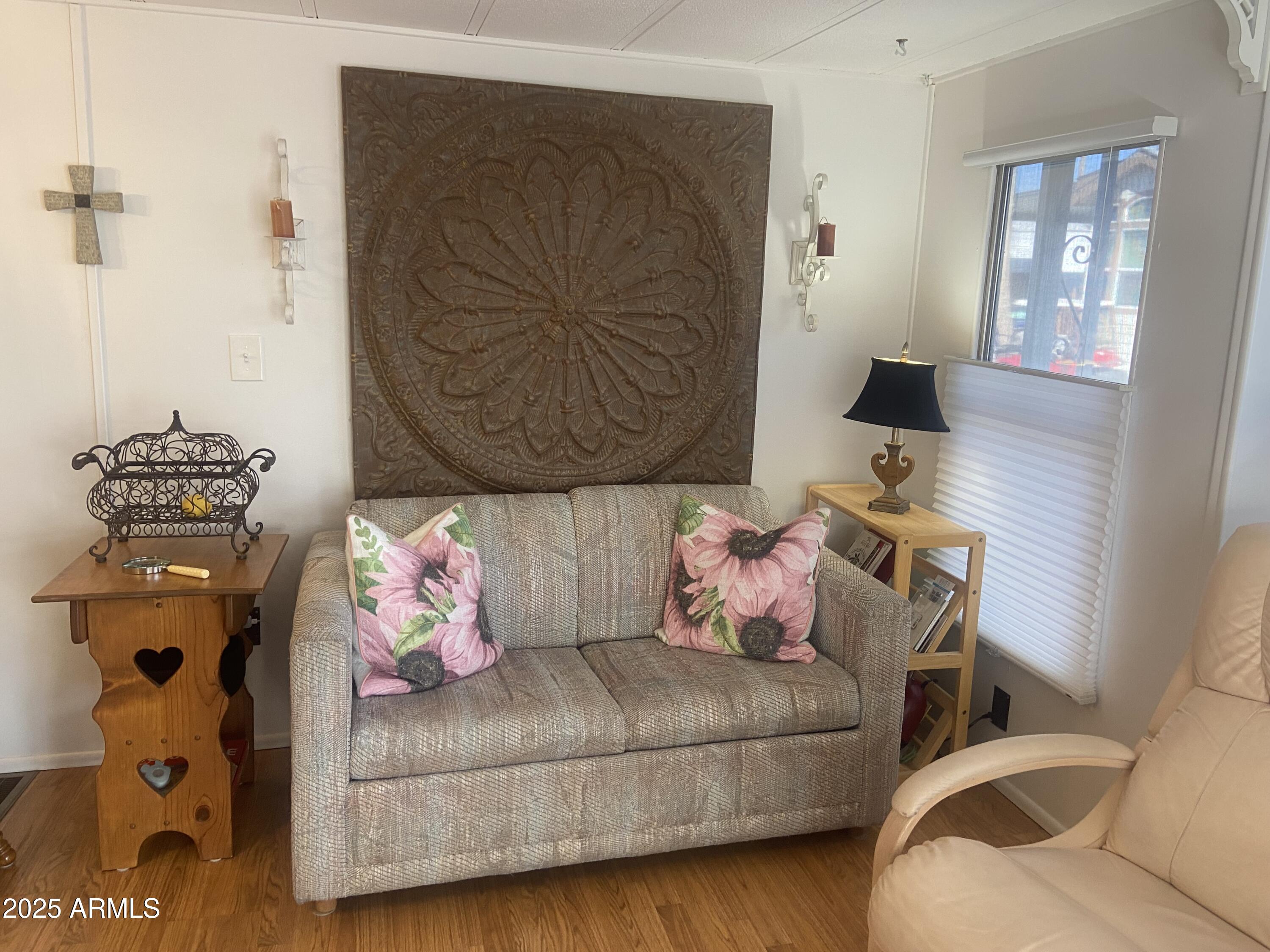 1135 South Sioux Drive Apache Junction, AZ 85119 - Photo 2 of 33 a bedroom with a bed and wooden floor