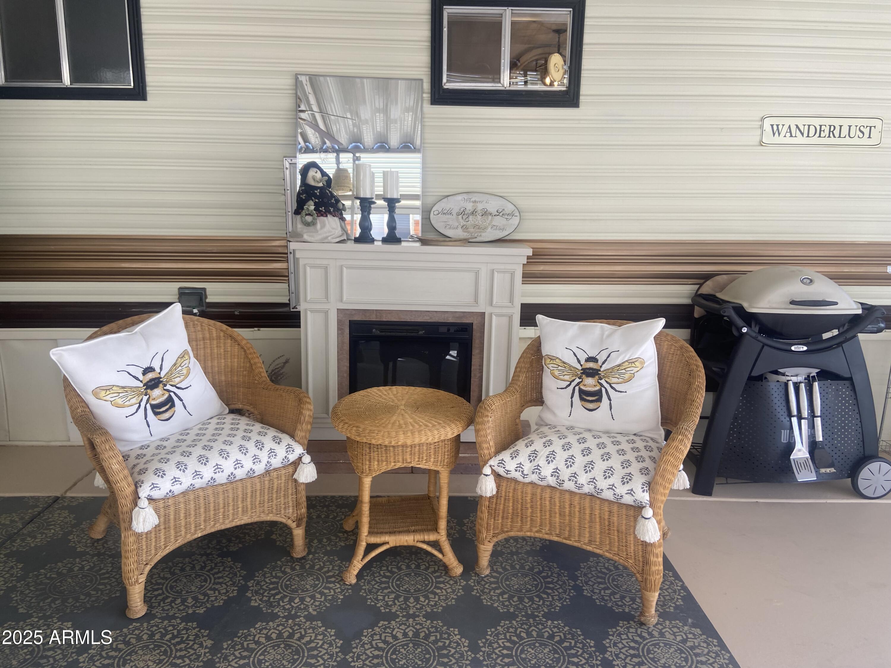 1135 South Sioux Drive Apache Junction, AZ 85119 - Photo 22 of 33 a living room with furniture and a fireplace
