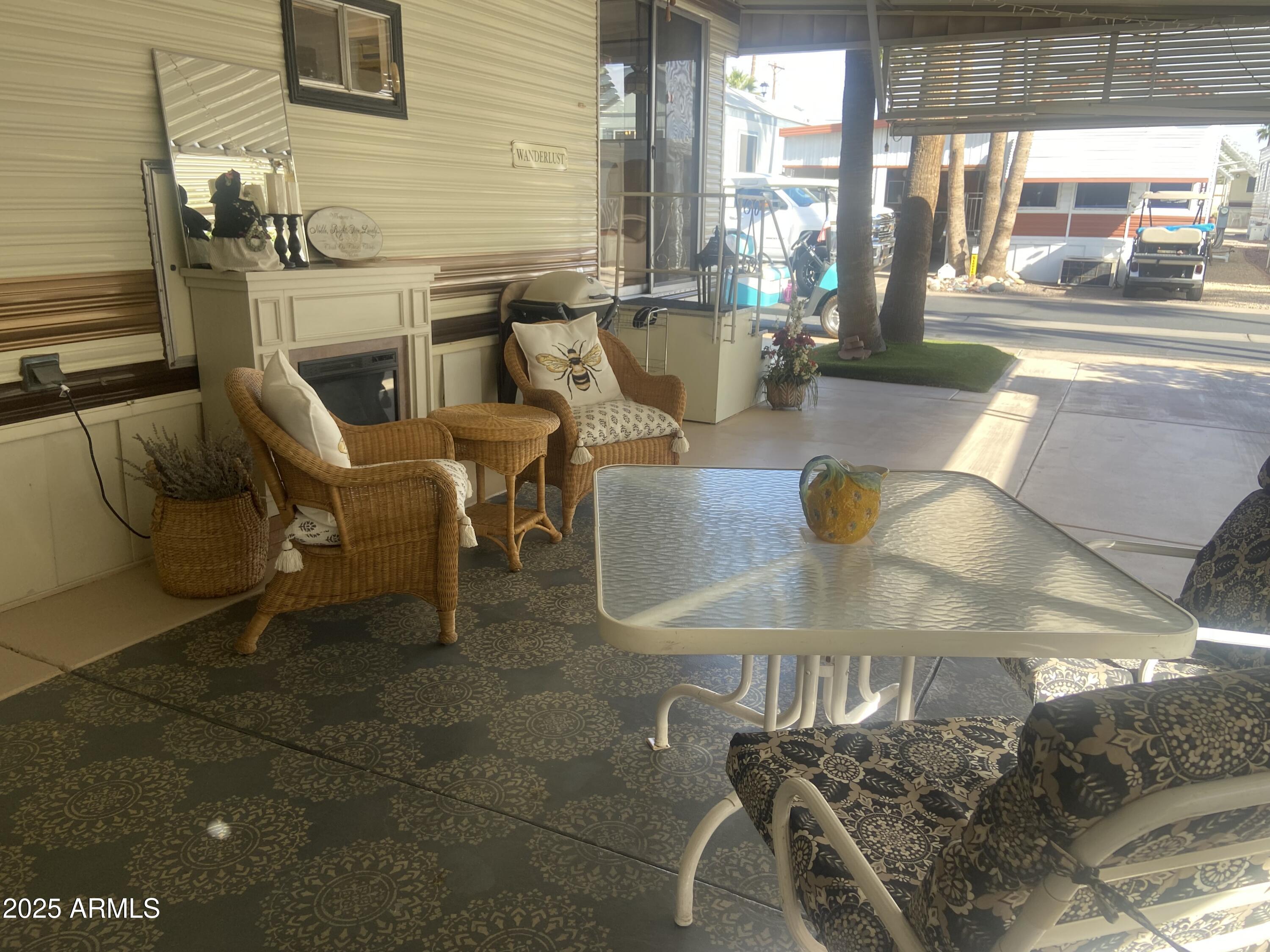 1135 South Sioux Drive Apache Junction, AZ 85119 - Photo 24 of 33 a view of a patio with couches chairs and potted plants