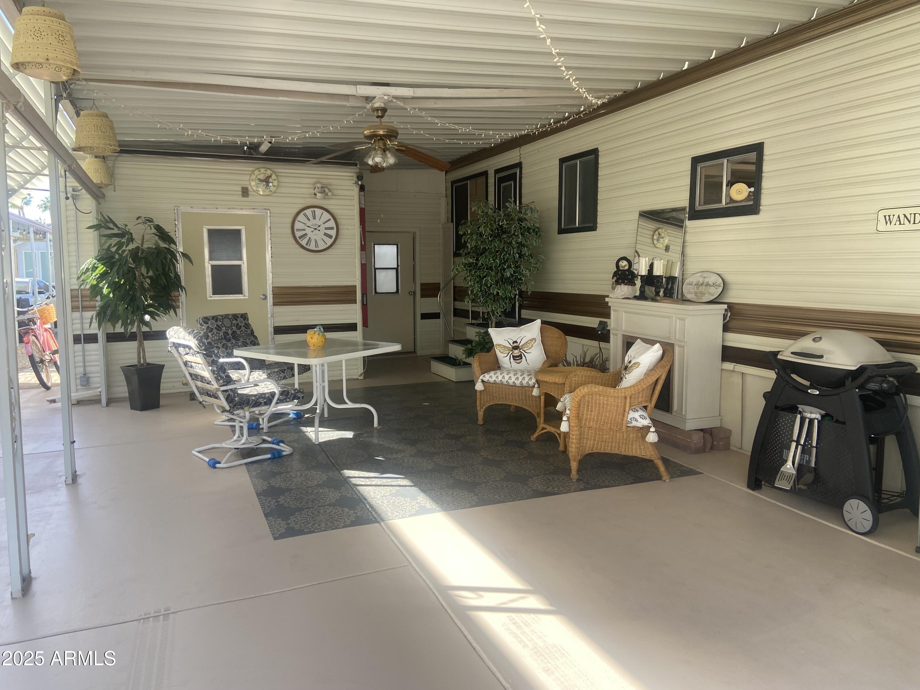 1135 South Sioux Drive Apache Junction, AZ 85119 - Photo 26 of 33 a living room with furniture and a flat screen tv