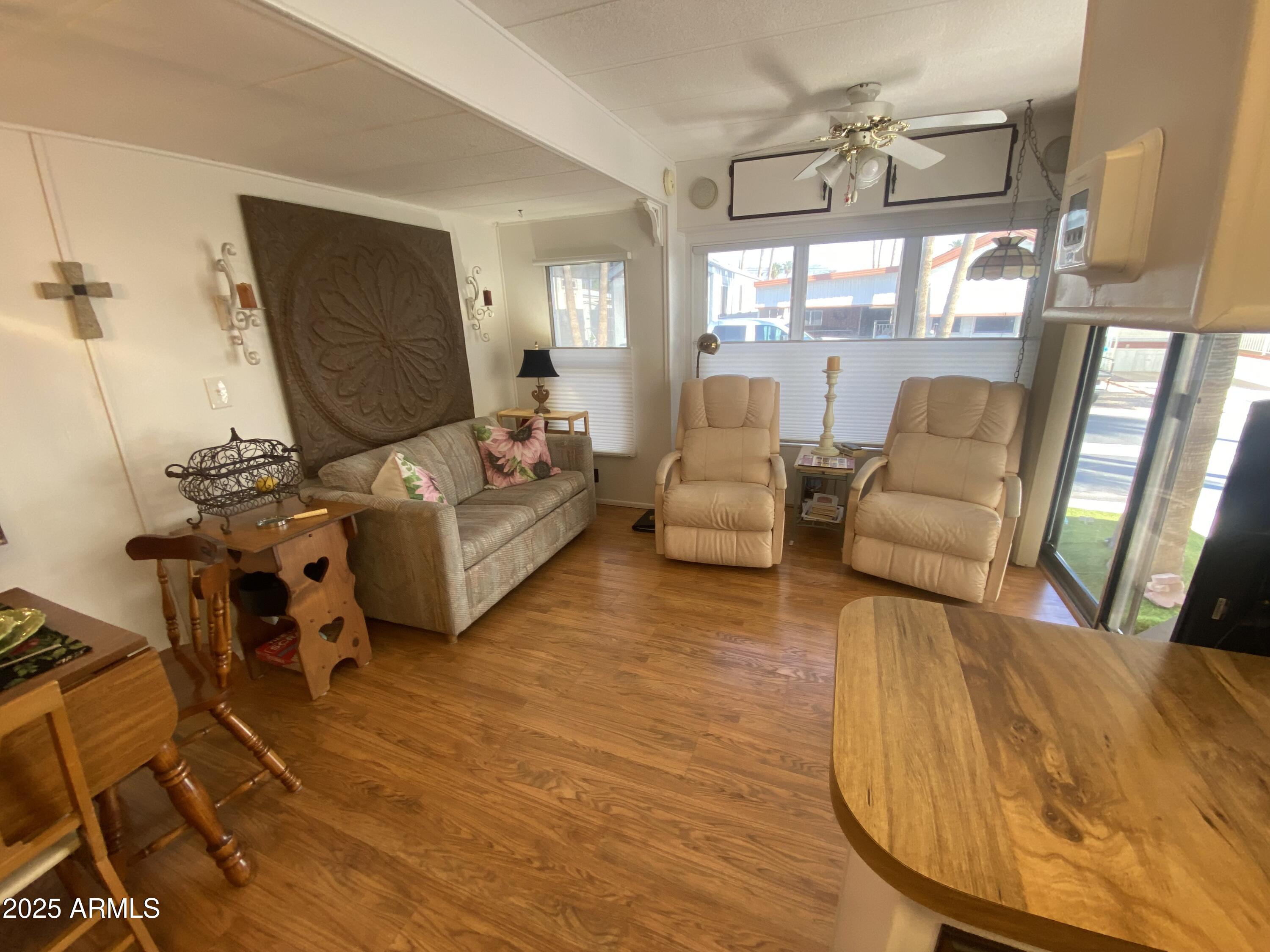 1135 South Sioux Drive Apache Junction, AZ 85119 - Photo 3 of 33 a living room with furniture and a large window