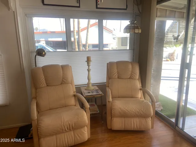 a living room with furniture and a window
