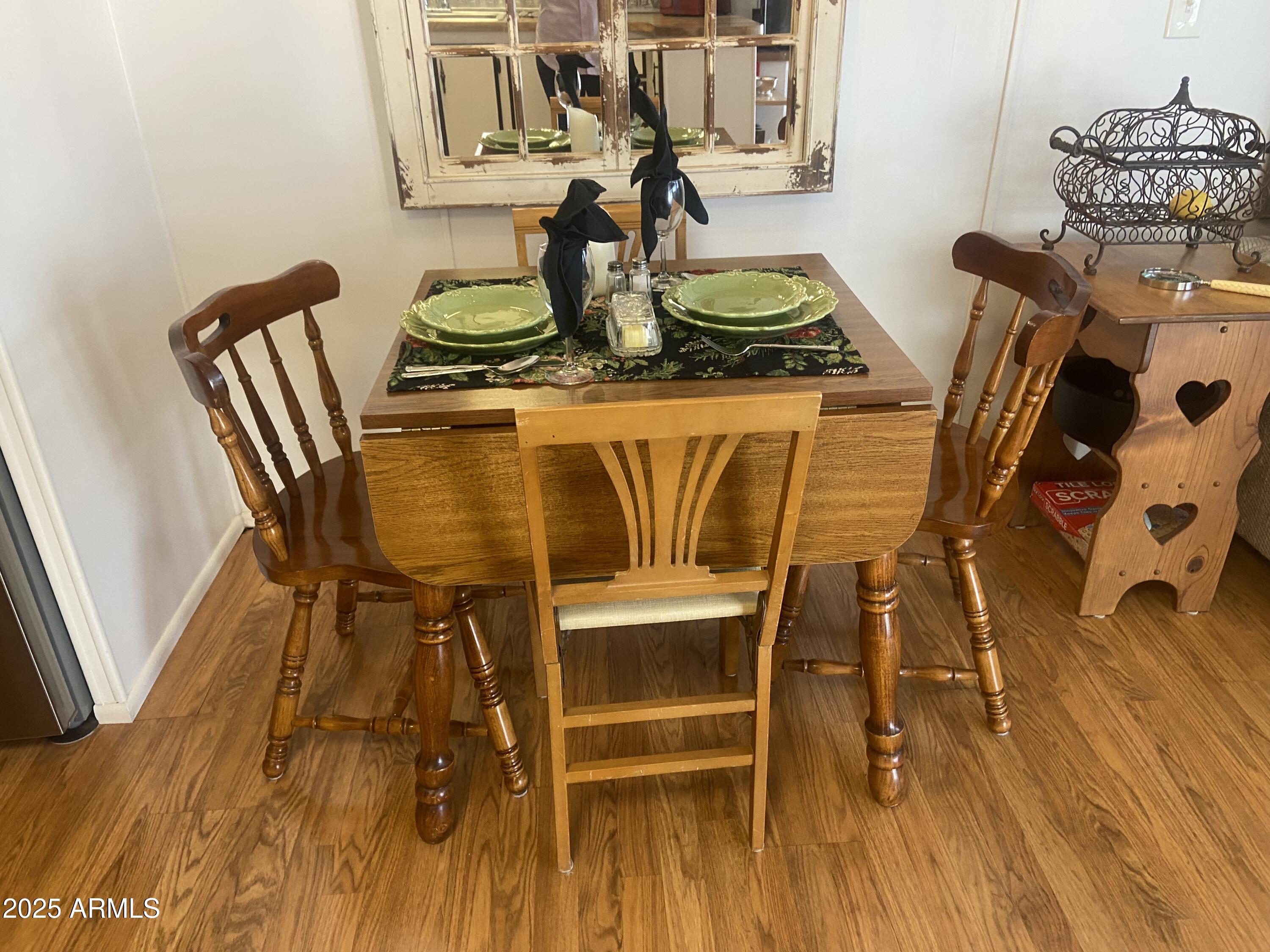 1135 South Sioux Drive Apache Junction, AZ 85119 - Photo 8 of 33 a dining room with furniture and wooden floor
