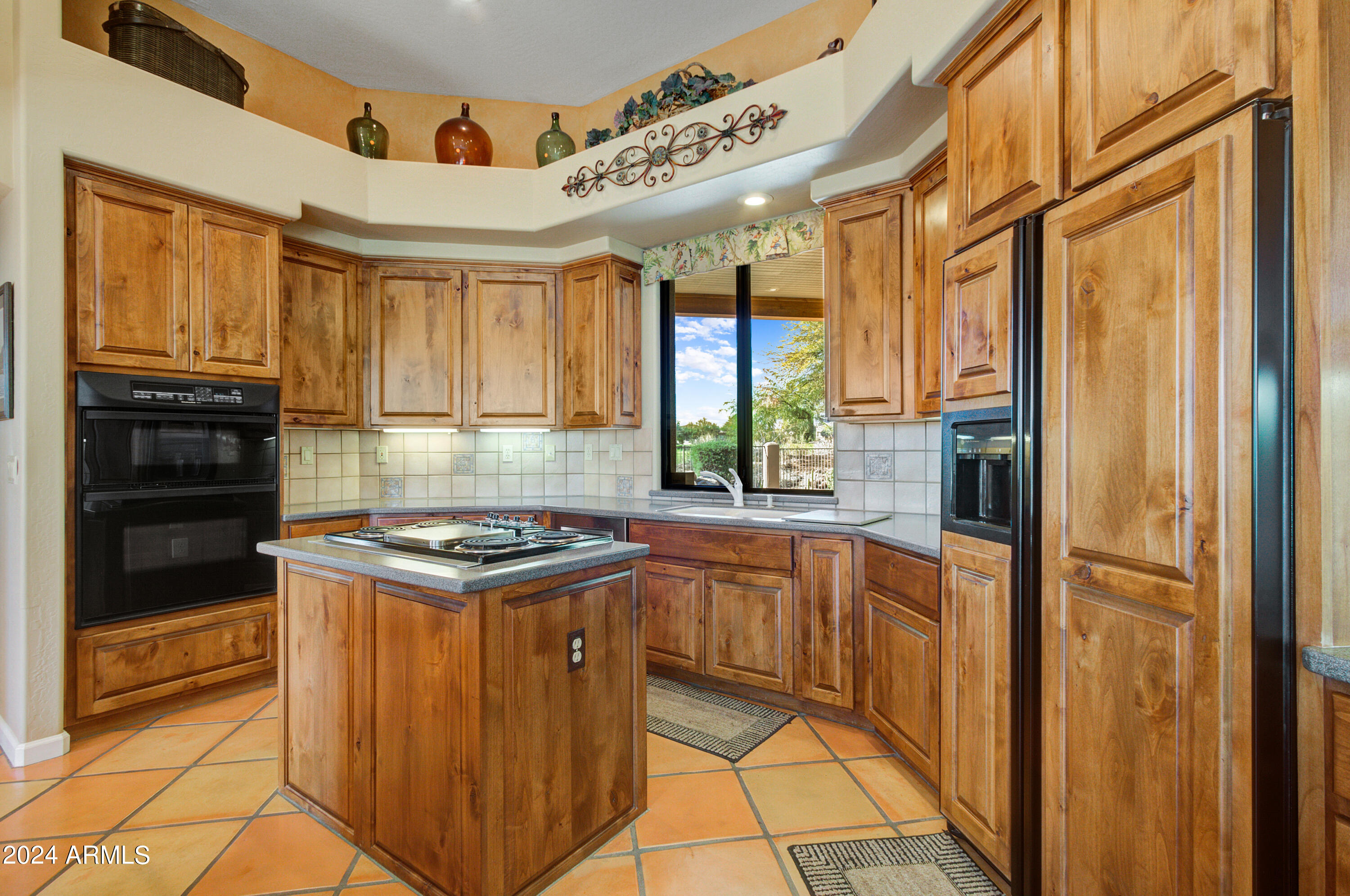 27820 North Lucero Drive Rio Verde, AZ 85263 - Photo 12 of 32 a kitchen with stainless steel appliances granite countertop a stove and a refrigerator