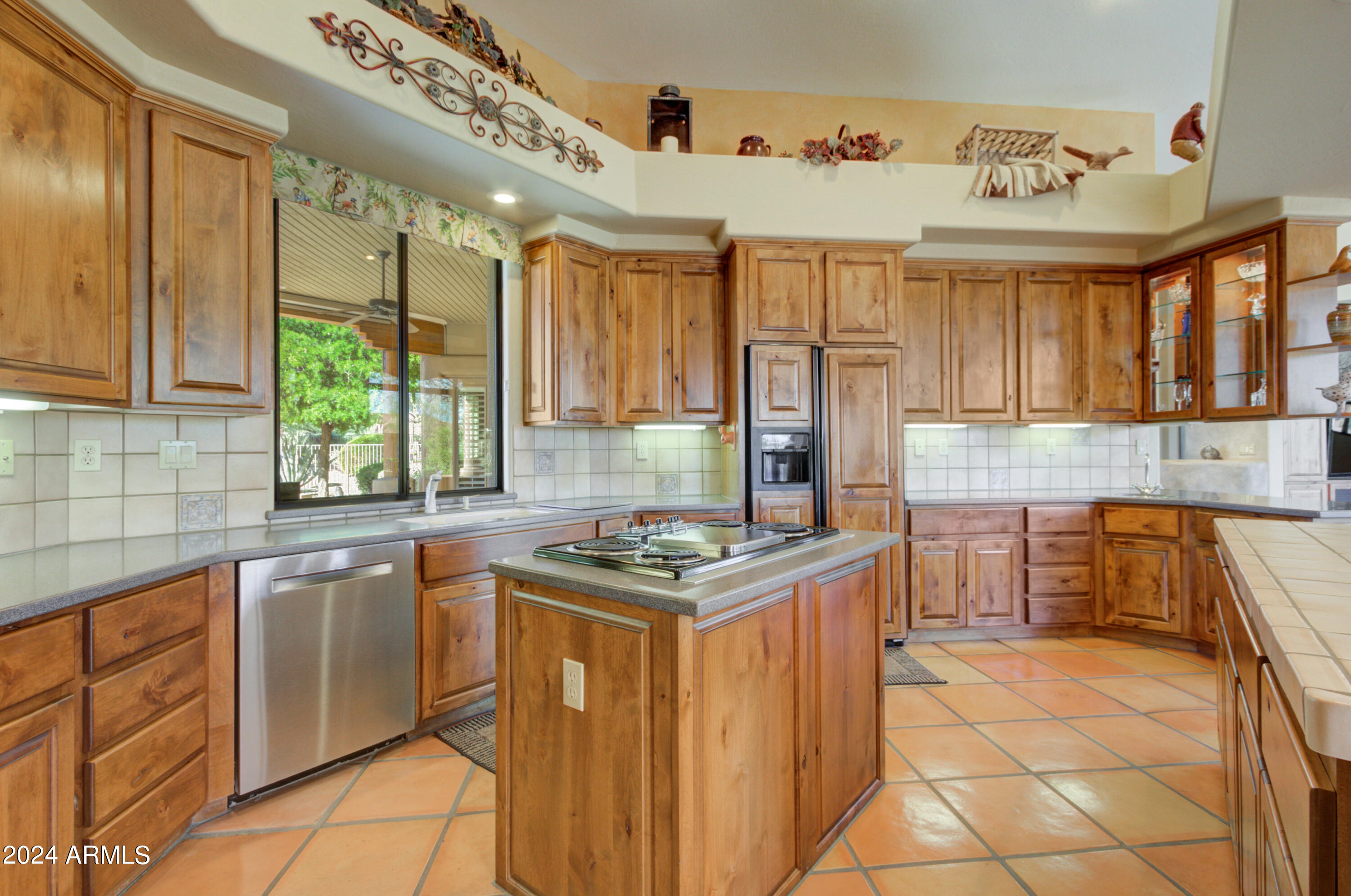 27820 North Lucero Drive Rio Verde, AZ 85263 - Photo 13 of 32 a kitchen with stainless steel appliances granite countertop a stove a sink and a refrigerator