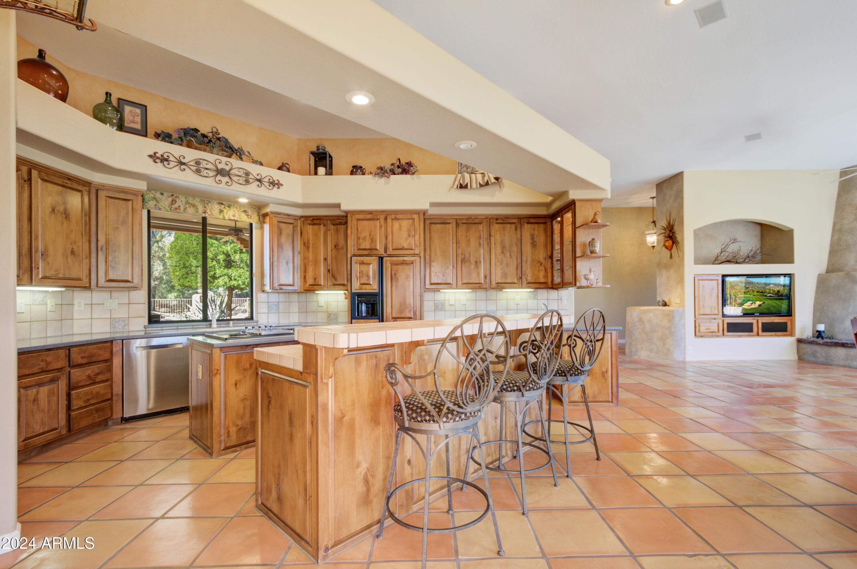 27820 North Lucero Drive Rio Verde, AZ 85263 - Photo 14 of 32 a large kitchen with a table and chairs in it