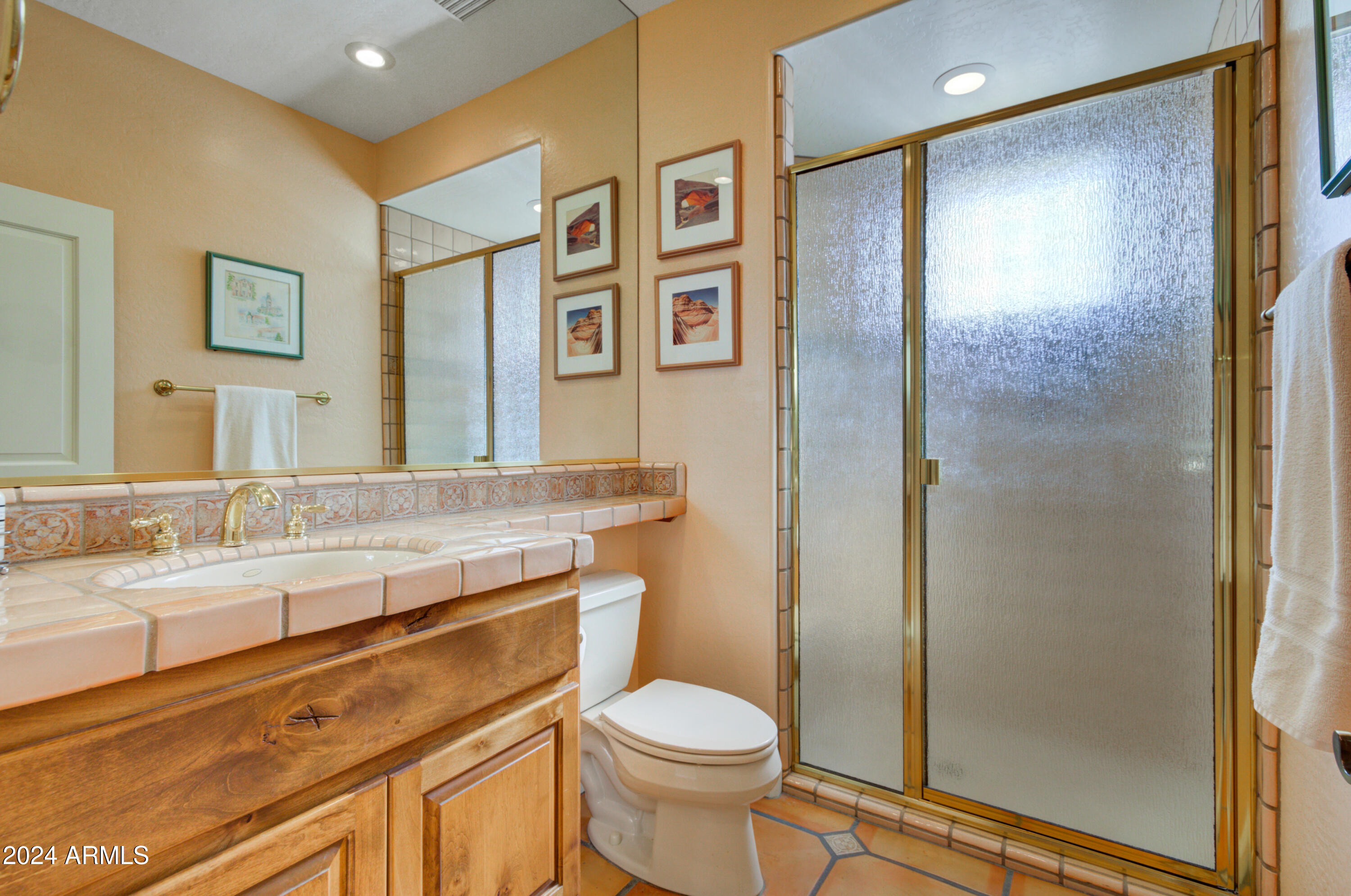 27820 North Lucero Drive Rio Verde, AZ 85263 - Photo 20 of 32 a bathroom with a granite countertop toilet sink and shower