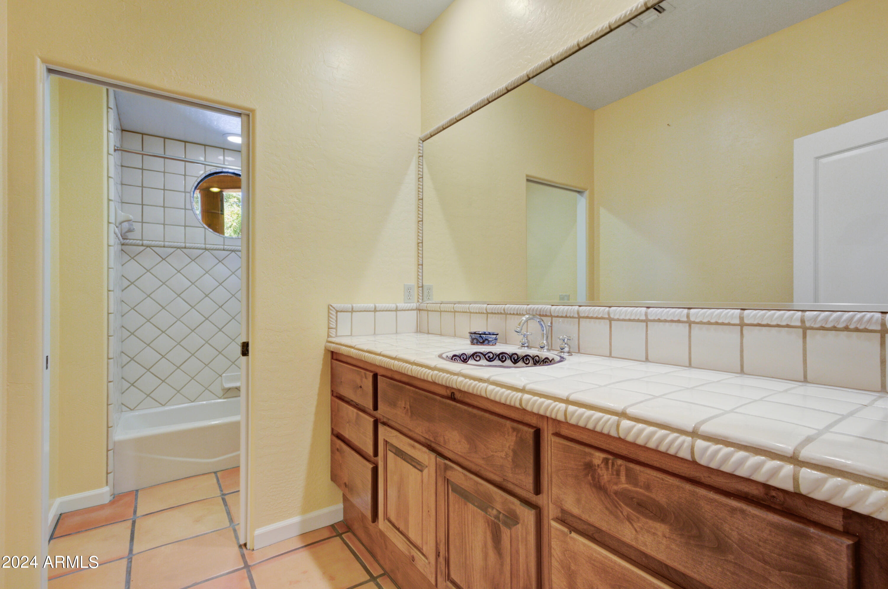 27820 North Lucero Drive Rio Verde, AZ 85263 - Photo 22 of 32 a bathroom with a granite countertop sink and a mirror