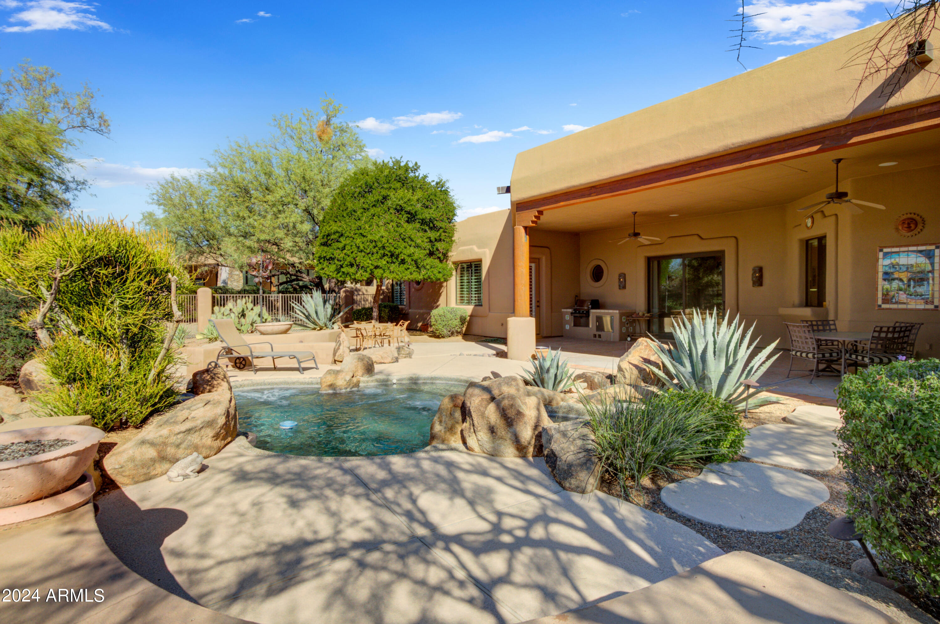 27820 North Lucero Drive Rio Verde, AZ 85263 - Photo 26 of 32 a view of a house with potted plants