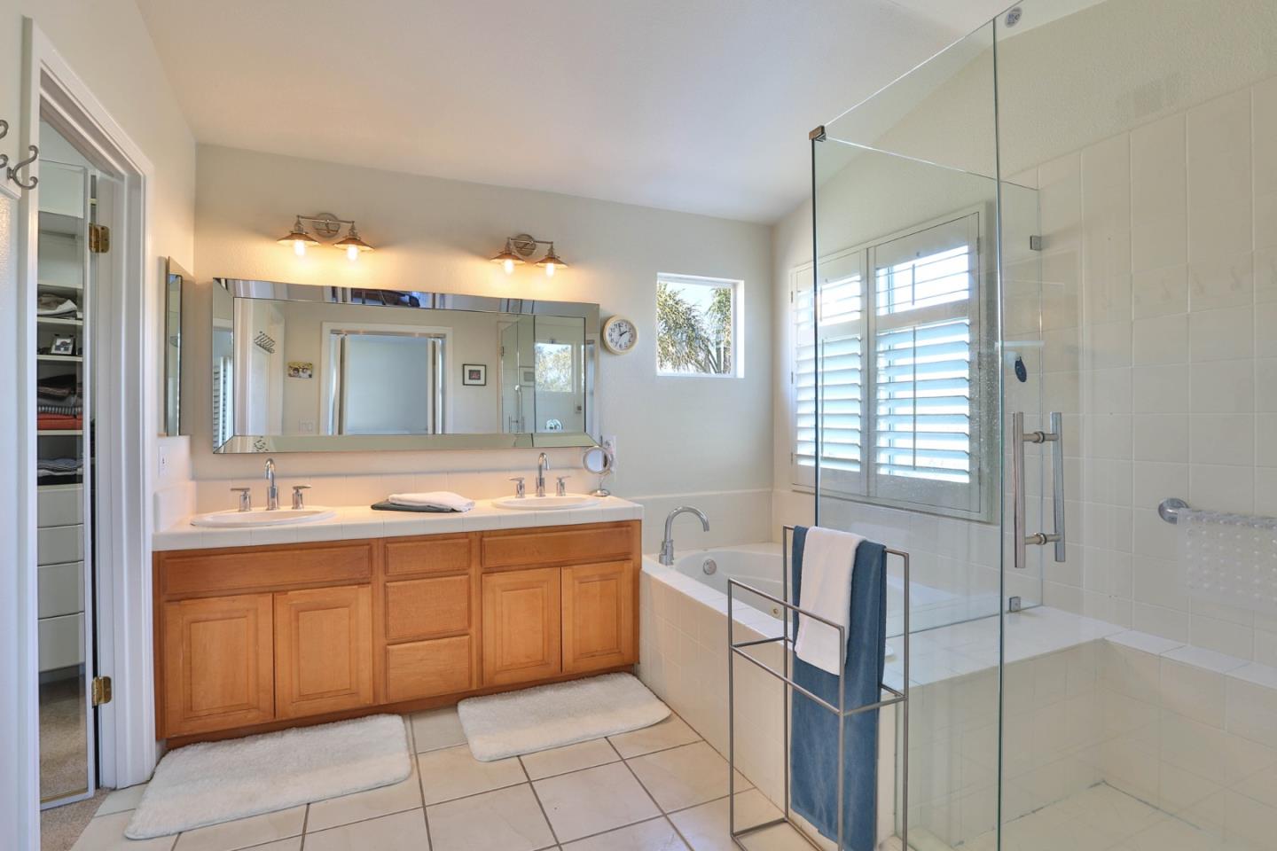 5409 Manderston Drive San Jose, CA 95138 - Photo 20 of 40 a spacious bathroom with a granite countertop sink mirror and bathtub