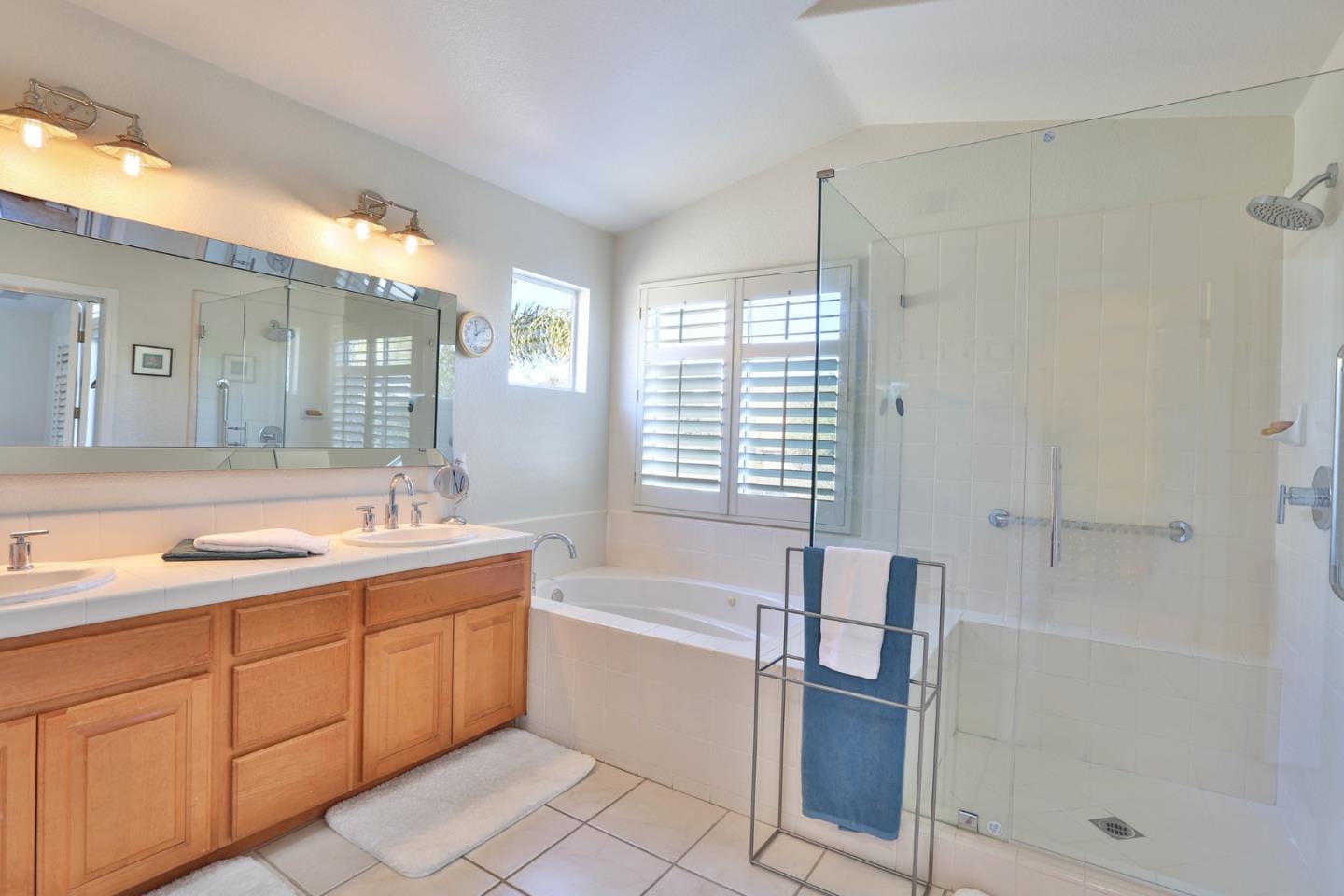 5409 Manderston Drive San Jose, CA 95138 - Photo 21 of 40 a bathroom with a tub sink and mirror