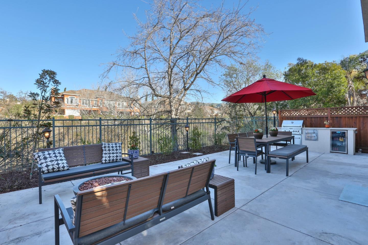 5409 Manderston Drive San Jose, CA 95138 - Photo 27 of 40 an outdoor sitting area with furniture and umbrella