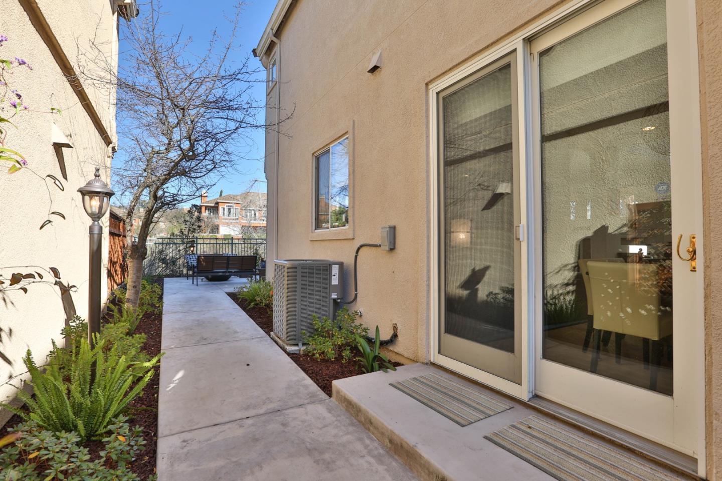 5409 Manderston Drive San Jose, CA 95138 - Photo 29 of 40 a view of a brick house with a glass door