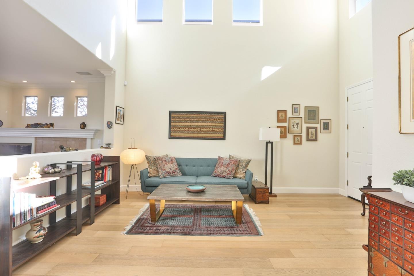 5409 Manderston Drive San Jose, CA 95138 - Photo 3 of 40 a living room with a couch and a dining table with wooden floor