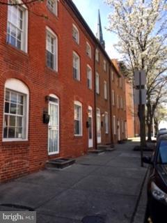 a front view of a building with many windows