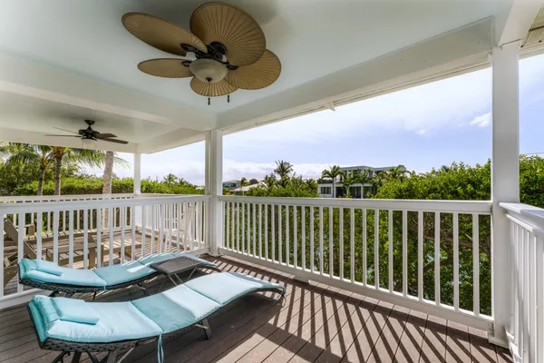 a view of balcony with wooden floor and outdoor seating