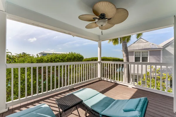 a view of a two chairs on the roof deck