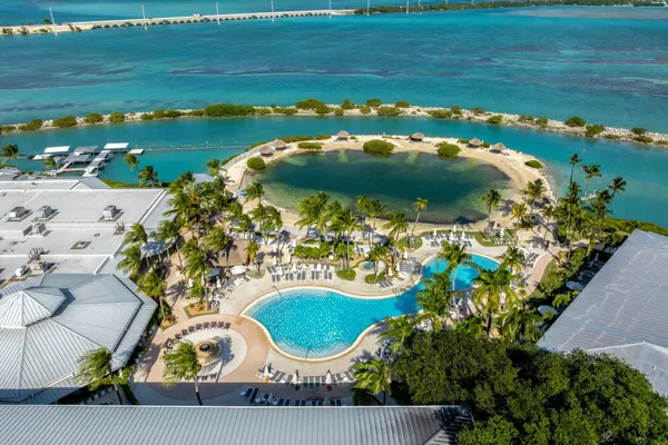 an aerial view of a house with a lake view