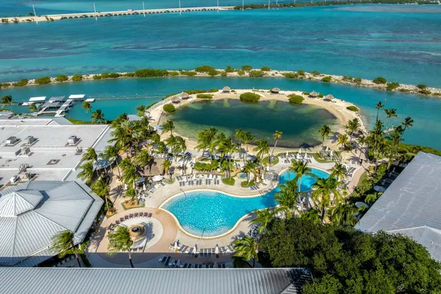 an aerial view of a house with a lake view