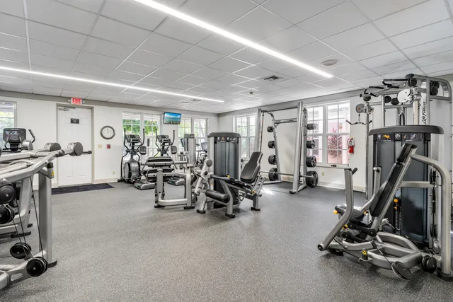 a dining room with furniture and a window