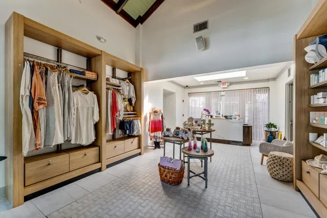 a view of a kitchen with wooden floor and electronic appliances
