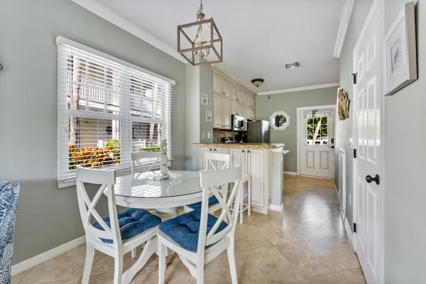 a dining room with furniture and window