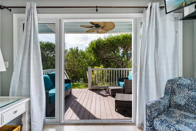 a living room with a large window and a couch