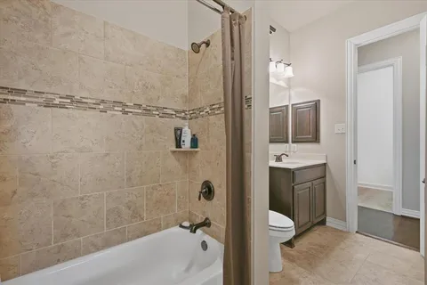 a bathroom with a shower and a sink