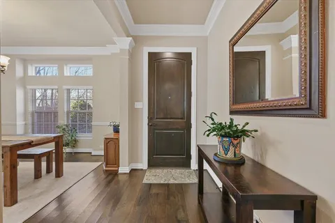 a living room with furniture and potted plant