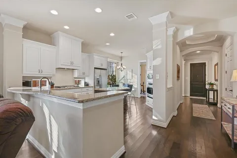 a kitchen with stainless steel appliances granite countertop a lot of counter top space and cabinets