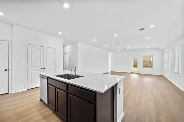 a kitchen with a sink and cabinets