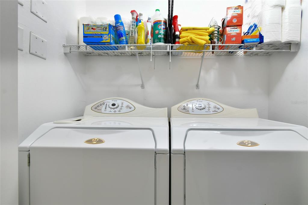 3454 Sunset Key Circle, Unit 103 Punta Gorda, FL 33955 - Photo 11 of 37 a utility room with dryer and washer