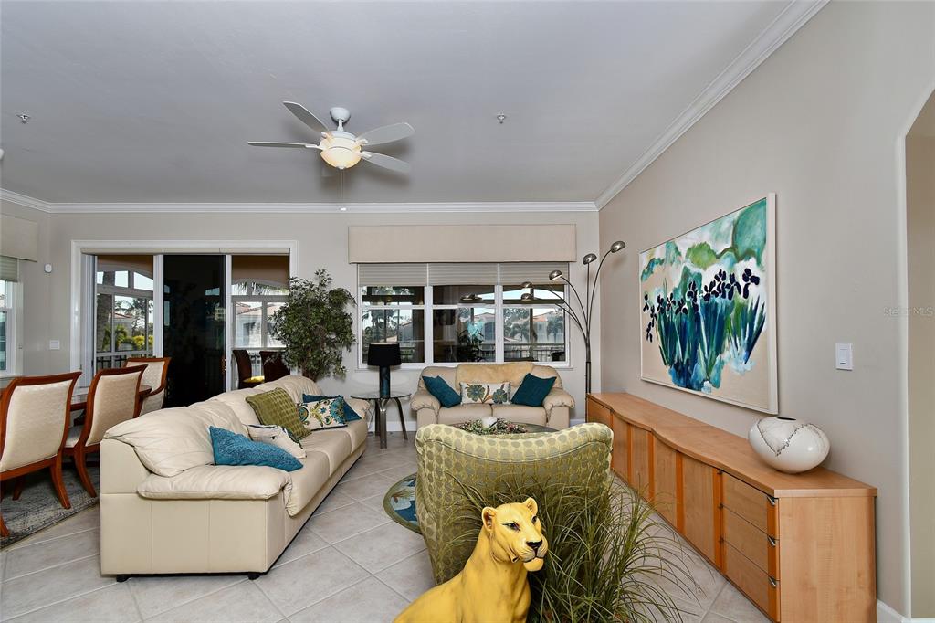 3454 Sunset Key Circle, Unit 103 Punta Gorda, FL 33955 - Photo 14 of 37 a living room with furniture and a large window