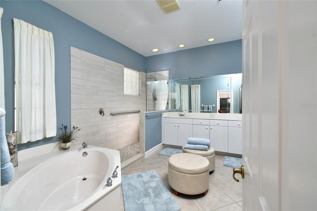 3454 Sunset Key Circle, Unit 103 Punta Gorda, FL 33955 - Photo 20 of 37 a bathroom with a sink a toilet and shower