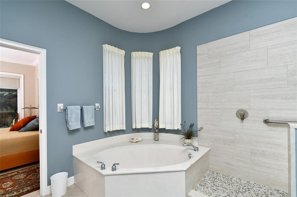 3454 Sunset Key Circle, Unit 103 Punta Gorda, FL 33955 - Photo 21 of 37 a bathroom with a sink and a bathtub