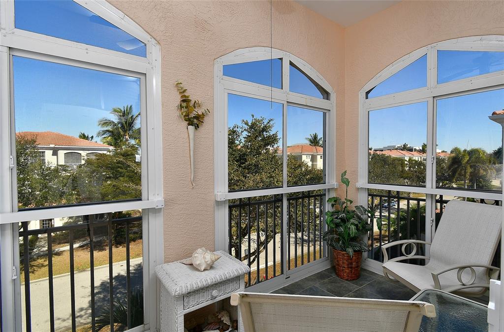 3454 Sunset Key Circle, Unit 103 Punta Gorda, FL 33955 - Photo 30 of 37 a view of a balcony with chairs