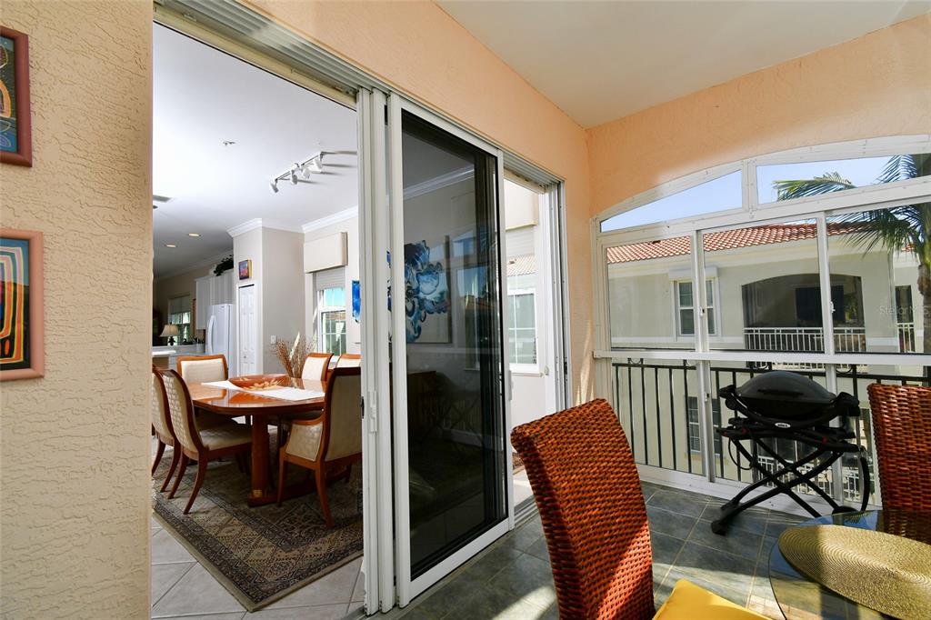 3454 Sunset Key Circle, Unit 103 Punta Gorda, FL 33955 - Photo 31 of 37 a dining room with furniture and window