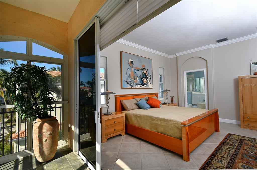 3454 Sunset Key Circle, Unit 103 Punta Gorda, FL 33955 - Photo 35 of 37 a bedroom with bed and glass window