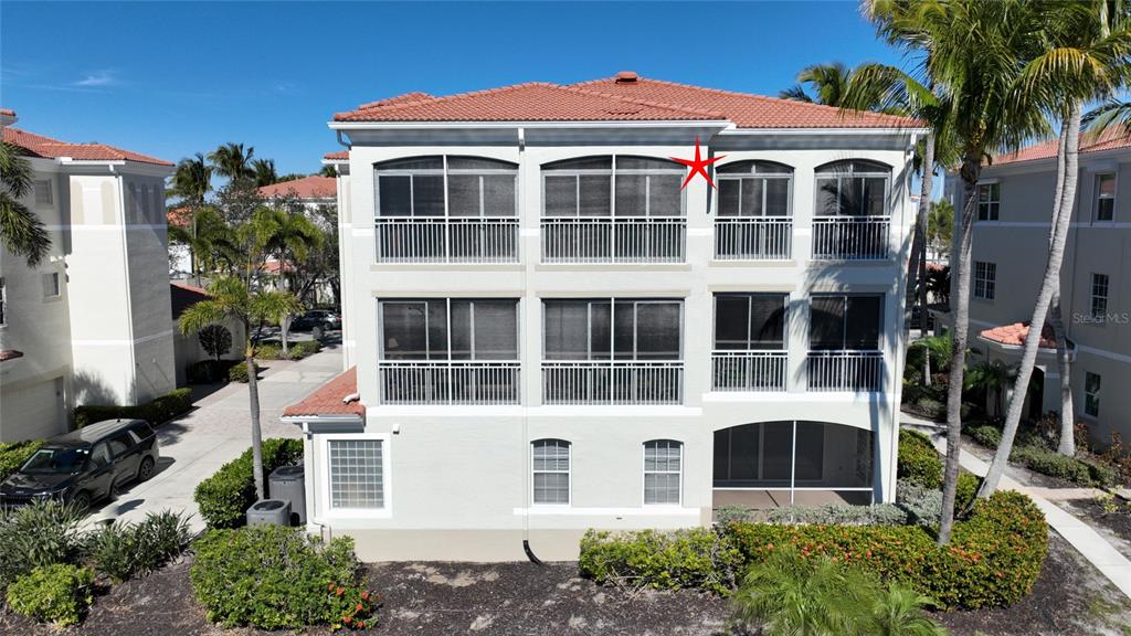 3454 Sunset Key Circle, Unit 103 Punta Gorda, FL 33955 - Photo 37 of 37 a front view of a house with a yard