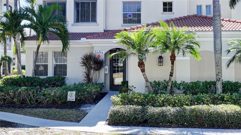 3454 Sunset Key Circle, Unit 103 Punta Gorda, FL 33955 - Photo 4 of 37 a front view of a house with a yard